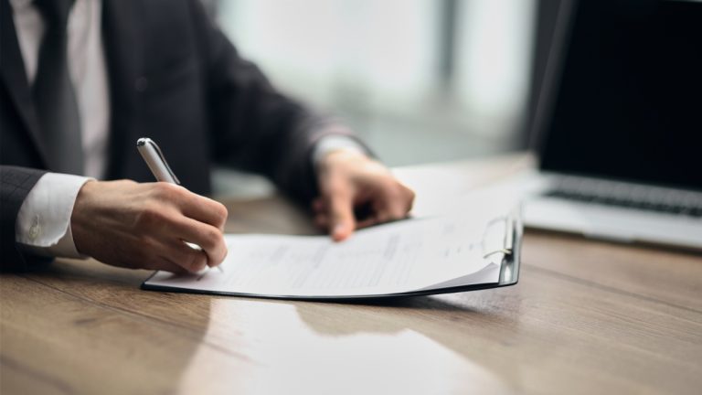 Businessman signs a contract