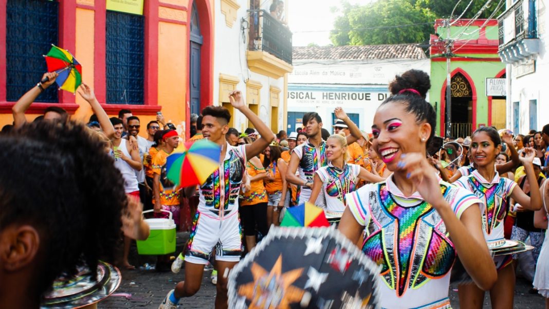 People celebrating a Brazilian carnival, part of the country's cultural heartbeat