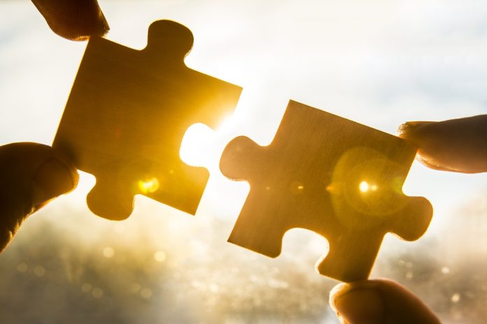 Puzzle pieces being joined as PopOK Gaming has formed a strategic partnership with the iGaming solutions provider inplaySoft