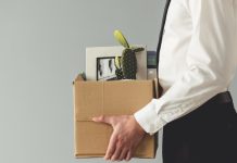 Impact of India’s RMG ban felt as jobs slashed Man holds cardboard box after losing job