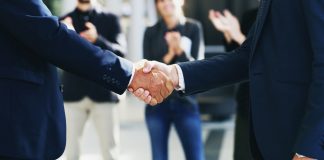 EveryMatrix adds front-end “firepower” with Goma Gaming acquisition Businessmen shake hands