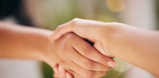 Omnitronix taps BetComply to support slot expansion Close up of a handshake