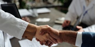 SkillOnNet strikes Swintt content deal Close up of a handshake