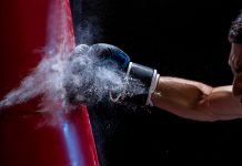 Amusnet lands knockout blow with latest crash game Close up of boxing gove striking punch bag