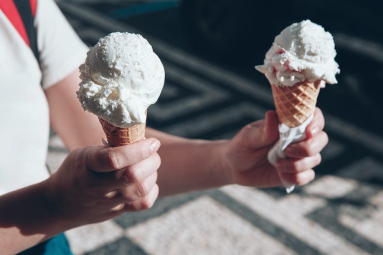 Girl holds two ice creams