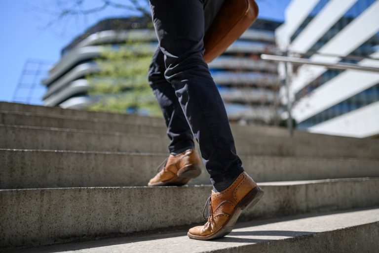 Businessman stepping up