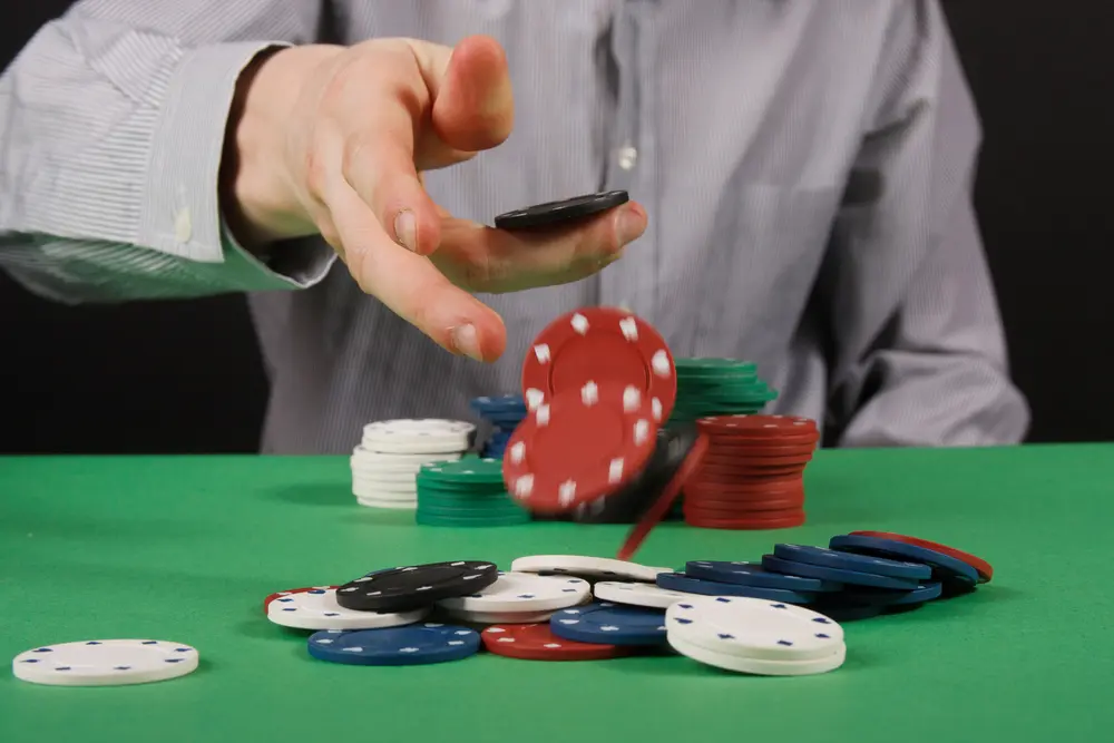 ICONIC21 free chips Poker chips being thrown down